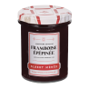Pot de Confiture Extra de Framboise Épépinée Albert Ménès, texture onctueuse et brillante dans son conditionnement verre